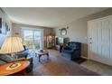 Spacious living room with comfy seating and access to a patio at 5877 N Granite Reef Rd # 2224, Scottsdale, AZ 85250