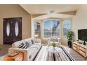 Bright living room featuring ample natural light from large windows and comfortable modern furnishings at 638 W Nido Ave, Mesa, AZ 85210