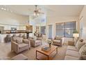 Open-concept living area with neutral tones, comfortable seating, and a seamless flow to the kitchen and dining space at 638 W Nido Ave, Mesa, AZ 85210