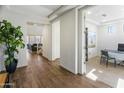 Bright entryway with wood-look floors, leading to an office and living area at 7180 W Tombstone Trl, Peoria, AZ 85383