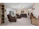 Living room with two recliner chairs and carpet flooring at 7807 E Main St # Cc-106, Mesa, AZ 85207