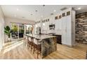 Modern kitchen with granite island and stainless steel appliances at 8729 E Indigo St, Mesa, AZ 85207