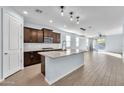 Modern kitchen with island, stainless steel appliances, and granite countertops at 11026 S 55Th Ln, Laveen, AZ 85339