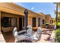 Spacious patio with seating area, umbrella, and grill at 14300 W Bell Rd # 207, Surprise, AZ 85374