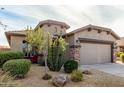 Charming one-story home with a two-car garage and xeriscaping at 157 W Latigo Cir, San Tan Valley, AZ 85143