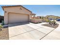 Two-car garage with ample driveway space in front at 16789 S 181St Ln, Goodyear, AZ 85338