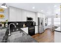 Modern kitchen with stainless steel appliances and granite countertops at 17642 E Hunt Hwy, Queen Creek, AZ 85142