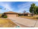 Front view of home showcasing garage and driveway at 17811 N Boswell Blvd, Sun City, AZ 85373