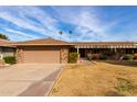 Single-story home with attached garage and landscaped yard at 17811 N Boswell Blvd, Sun City, AZ 85373