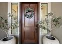 Elegant front door entrance with olive tree planters at 19019 E Via Hermosa --, Rio Verde, AZ 85263