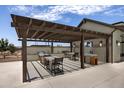 Community features an outdoor kitchen with pergola and seating at 22669 E Happy Rd, Queen Creek, AZ 85142