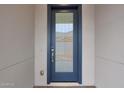 Beautiful blue front door with glass panel and modern hardware at 22670 E Happy Rd, Queen Creek, AZ 85142