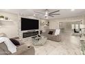 Spacious living room with fireplace and large TV at 2317 W Danbury Rd, Phoenix, AZ 85023