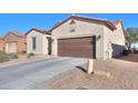 View of the home's garage and driveway from the street at 2622 E Marcos Dr, Casa Grande, AZ 85194