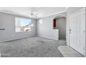 Bright living room with gray walls and carpet, plus a view at 29606 N Tatum Blvd # 216, Cave Creek, AZ 85331