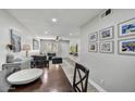 Charming dining area with a dark wood table and gray cabinet at 3301 E Earll Dr # 102, Phoenix, AZ 85018