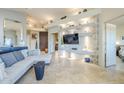 Spacious living room with light-colored L-shaped sofa and built-in entertainment center at 3324 E Maldonado Dr, Phoenix, AZ 85042