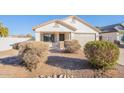 Landscaped front yard with drought-tolerant shrubs and gravel at 34403 N Damietta Trl, San Tan Valley, AZ 85143