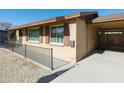 House exterior showcasing a carport and well-maintained yard at 3750 W Marshall Ave, Phoenix, AZ 85019