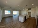 Open concept kitchen with island and stainless steel appliances at 3752 W Antelope Way, San Tan Valley, AZ 85144