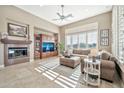 Spacious living room with fireplace and large windows at 40610 N Bradon Ct, Phoenix, AZ 85086