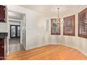 Formal dining area with hardwood floors and elegant chandelier at 4540 N 44Th St # 69, Phoenix, AZ 85018