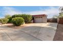 House exterior with driveway and landscaping at 5715 W Heatherbrae Dr, Phoenix, AZ 85031