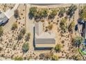 Aerial view showcasing a house's rear elevation, landscaping, and a spacious backyard at 5950 E Lowden Ct, Cave Creek, AZ 85331