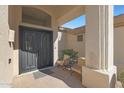 Front entry with seating area and double doors at 6406 E Helm Dr, Scottsdale, AZ 85254