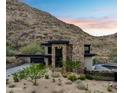 Mountain contemporary home with a pool and desert landscaping at 8200 N Charles Dr, Paradise Valley, AZ 85253