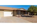 White garage door and driveway at 9676 W Mountain View Rd # B, Peoria, AZ 85345