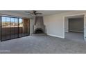 Bright living room with fireplace and sliding glass doors to balcony at 10410 N Cave Creek Rd # 2011, Phoenix, AZ 85020