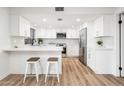 Modern white kitchen with stainless steel appliances at 11225 S Tomah St, Phoenix, AZ 85044