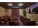 Community theater room with brown leather seating at 1367 S Country Club Dr # 1024, Mesa, AZ 85210