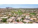 Aerial showing community, landscape, and golf course views at 1604 E Sheena Dr, Phoenix, AZ 85022