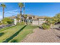 Two-story home with attractive landscaping and large driveway at 1604 E Sheena Dr, Phoenix, AZ 85022