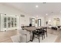 Elegant dining room with a built-in wine storage and hardwood floors at 16446 N 56Th Way, Scottsdale, AZ 85254