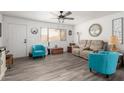 Living room with teal armchairs and neutral sofa at 1724 W 15Th Ave, Apache Junction, AZ 85120