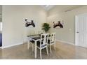 Charming dining area with a four-person table and a light-filled atmosphere at 18903 N 87Th Dr, Peoria, AZ 85382