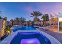 Luxury backyard oasis featuring a sparkling pool, spa, and relaxing patio area at 19034 N 94Th Way, Scottsdale, AZ 85255