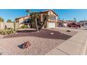 Two-story house with a large garage and desert landscaping at 1918 E Hearn Rd, Phoenix, AZ 85022