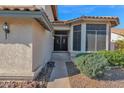 Front entrance with double doors and sidelights, leading to a walkway at 19222 N 70Th Ave, Glendale, AZ 85308