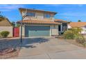 House exterior showcasing green garage door and basketball hoop at 19222 N 70Th Ave, Glendale, AZ 85308