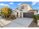 Two-story house with a landscaped front yard and attached garage at 19961 W Heatherbrae Dr, Litchfield Park, AZ 85340