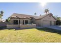 Single-story home with two-car garage and well-manicured lawn at 2265 E Mallard Ct, Gilbert, AZ 85234