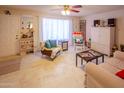 Bright living room featuring comfy seating and large window at 2613 E Michigan Ave, Phoenix, AZ 85032