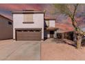 Two-story house with a brown garage door and desert landscaping at 3234 S Bowman Rd, Apache Junction, AZ 85119