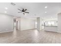 Spacious living room with tile flooring and a ceiling fan at 34909 N Palm Dr, San Tan Valley, AZ 85140