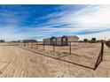 Side view of a single story home with a chain link fence at 36747 W Harrison St, Tonopah, AZ 85354