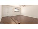 Bright living room with hardwood floors and ceiling fan at 3744 W Malapai Dr, Phoenix, AZ 85051